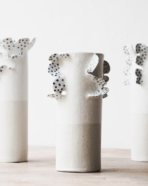 Handmade vases with scallop details and blue freckles by clay beehive ceramics