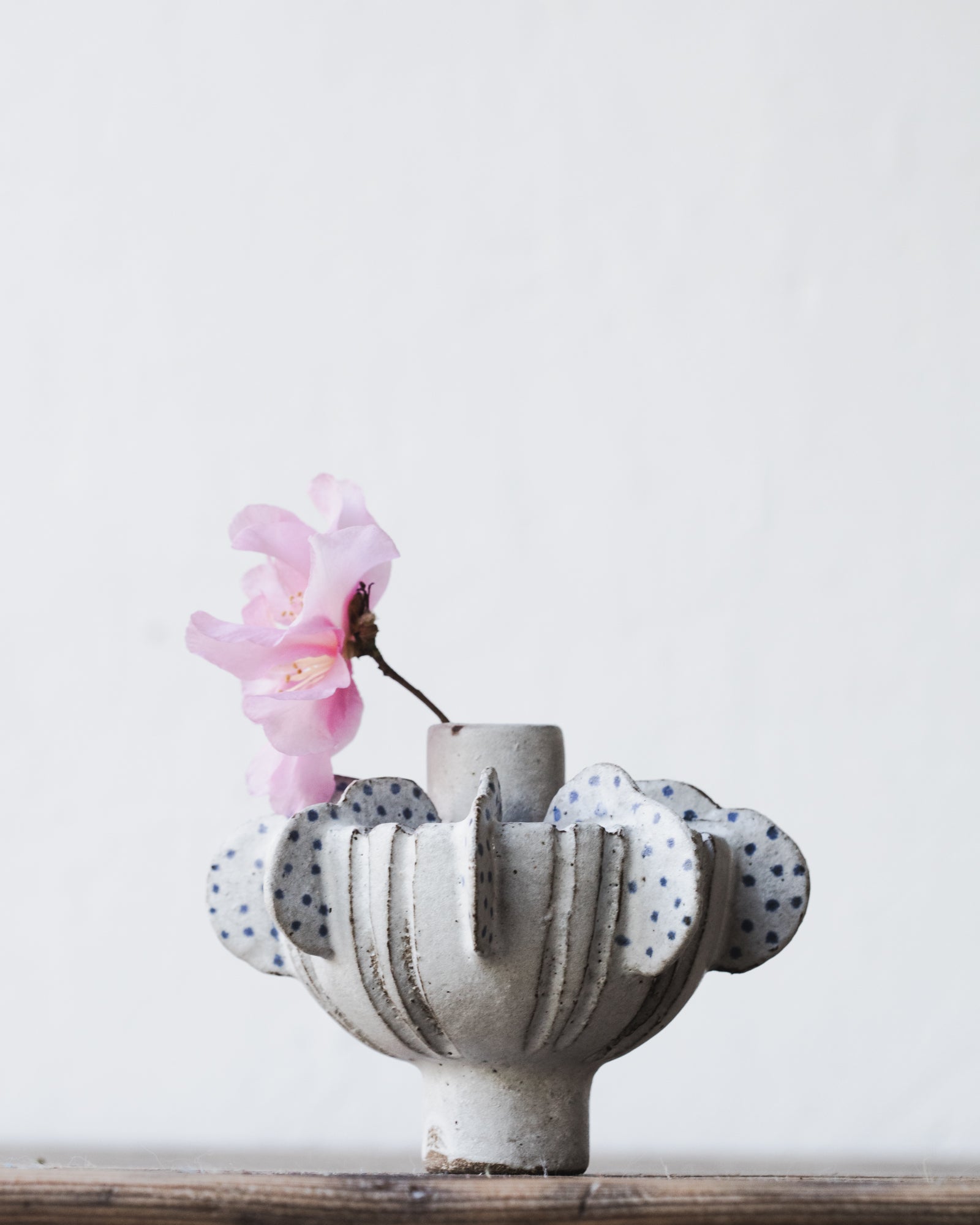 Ceramic sculptural vase with wings and blue spots by clay beehive ceramics