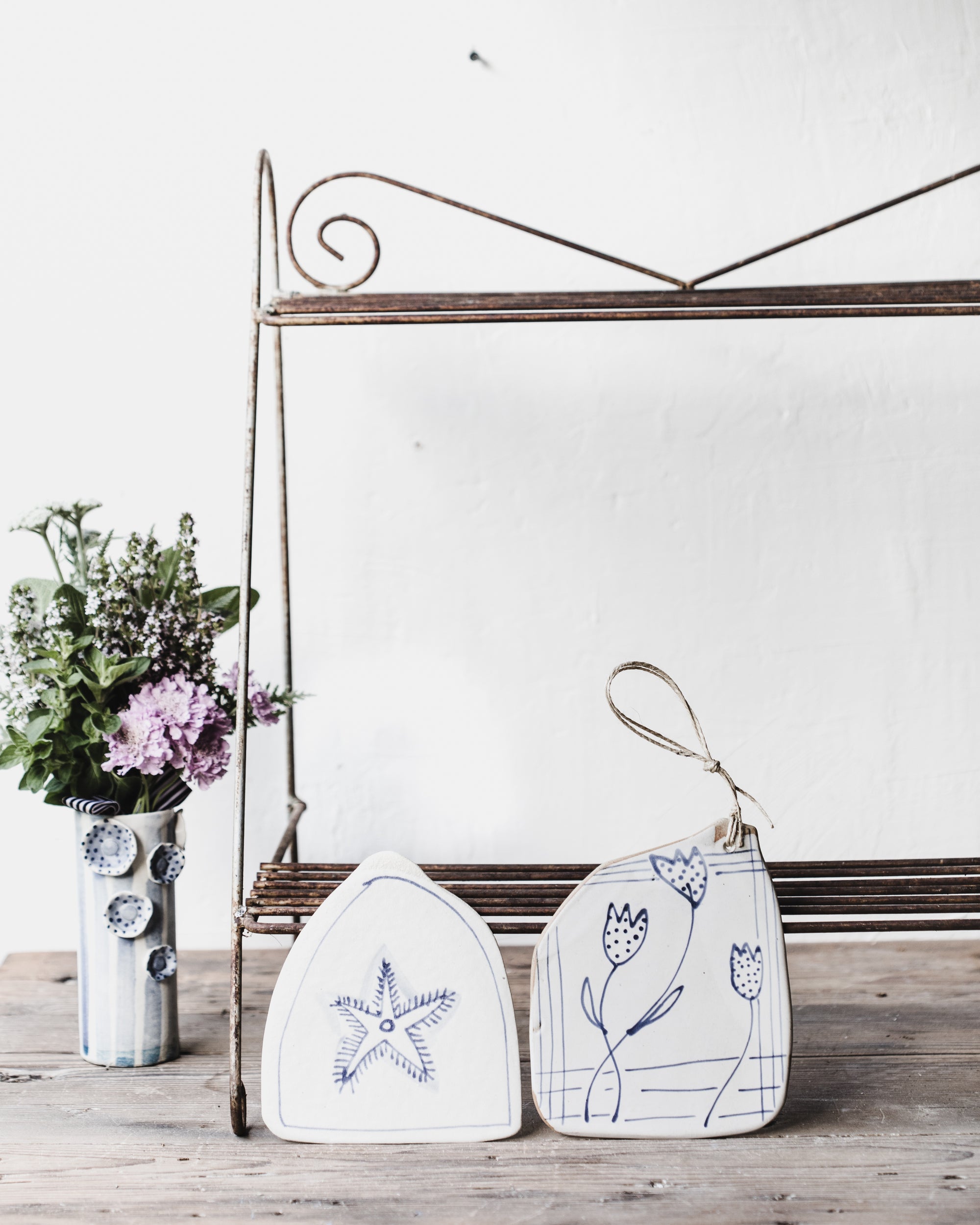 Blue and white ceramic Cheeseboards with decorative patterns and illustrations by clay beehive ceramics