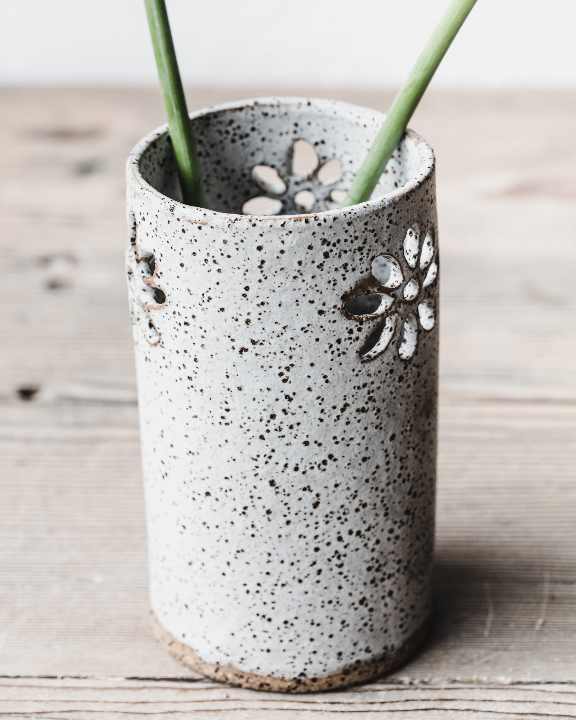 Rustic flower cutout speckled white vase handmade by clay beehive ceramics