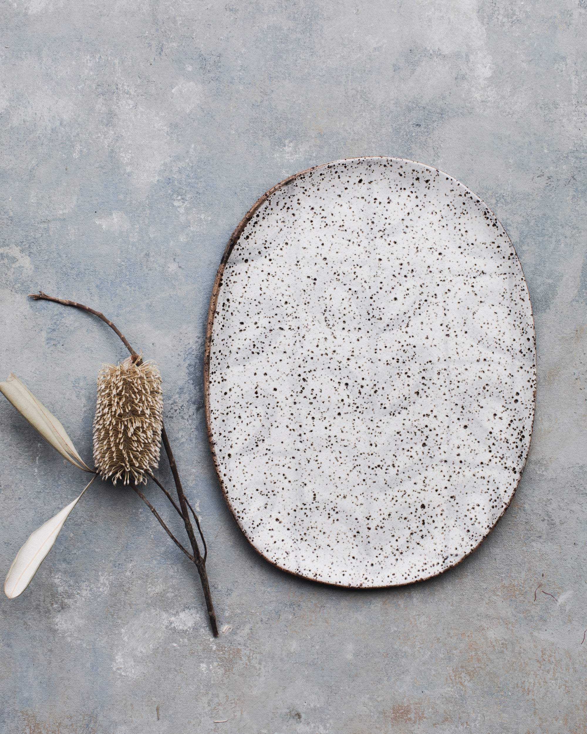 Handmade speckled white ceramic oval shaped platter plate 29.5cm long x 23cm wide created by clay beehive