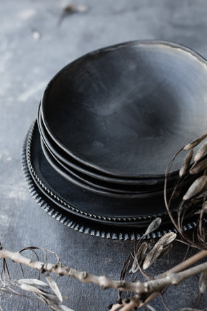 Bowls with a satin matte charcoal glaze and organic shape