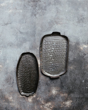 wabi sabi plates with matte black glaze and textured surface hand made by clay beehive ceramics