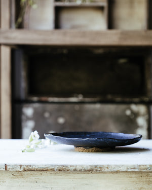 black stoneware footed bowl handmade by clay beehive ceramics