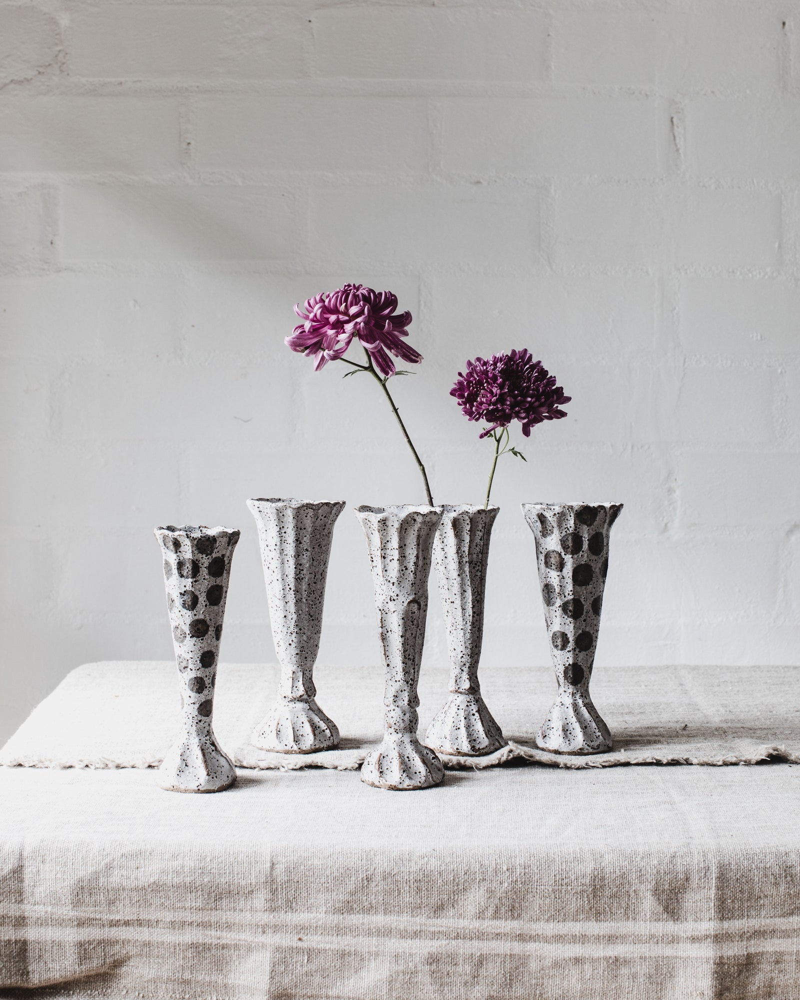 Rustic polka dot grey and white pedestal vases handmade by Clay Beehive Ceramics