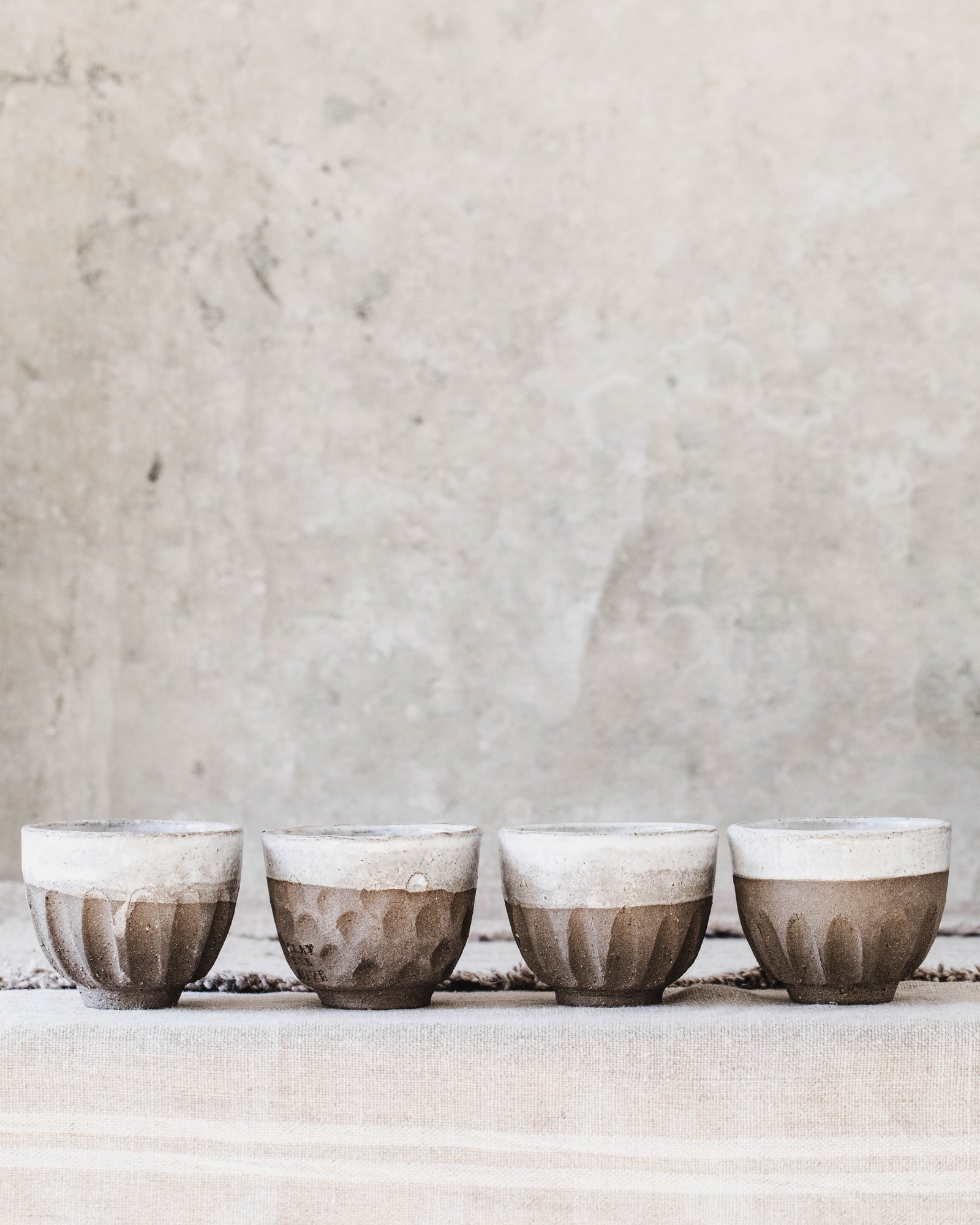 Rustic handmade ceramic footed carved cup by clay beehive ceramics