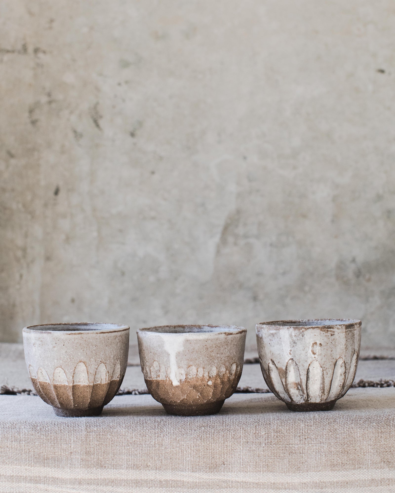 Rustic handmade ceramic footed carved cup by clay beehive ceramics