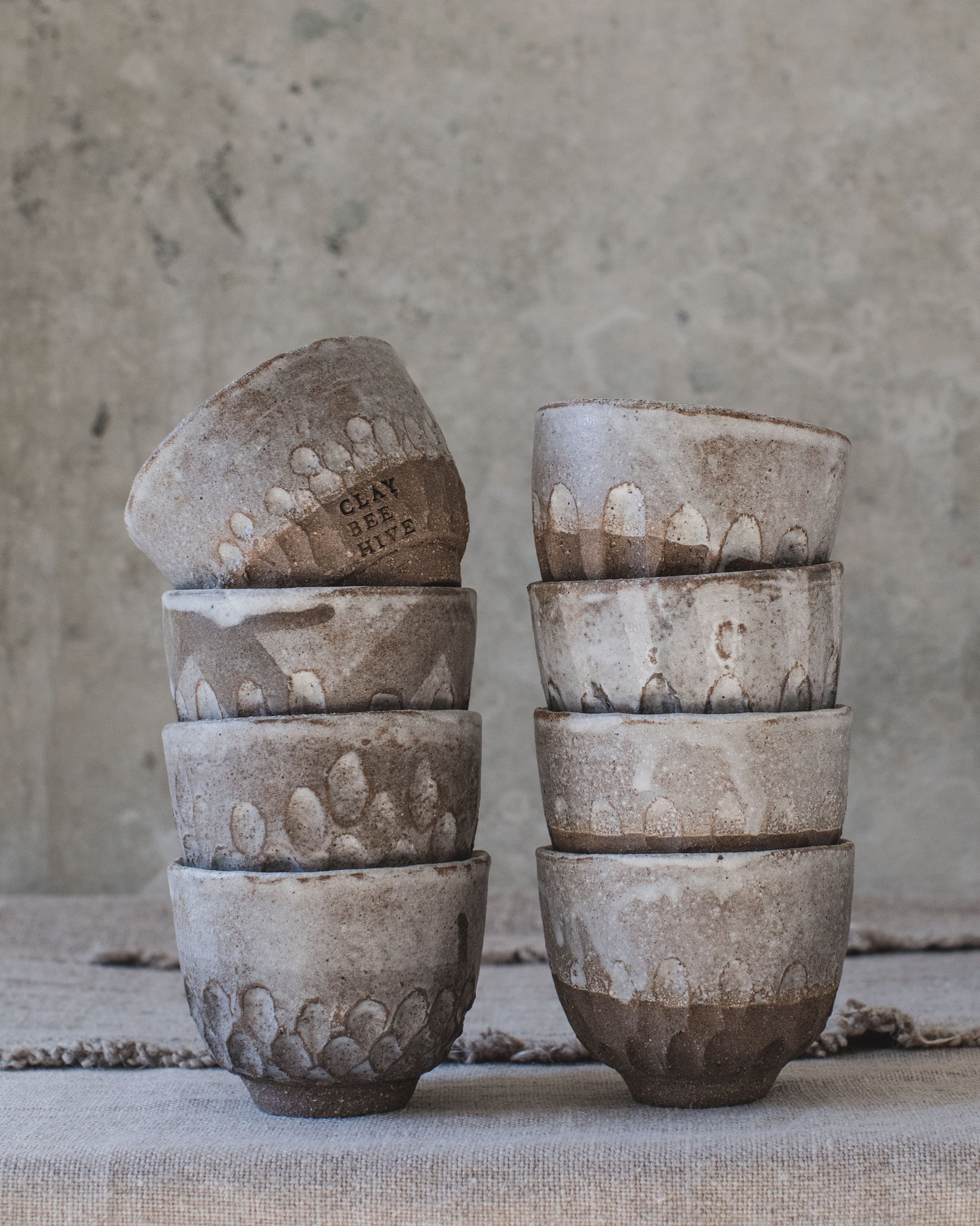 Rustic handmade ceramic footed carved cup by clay beehive ceramics