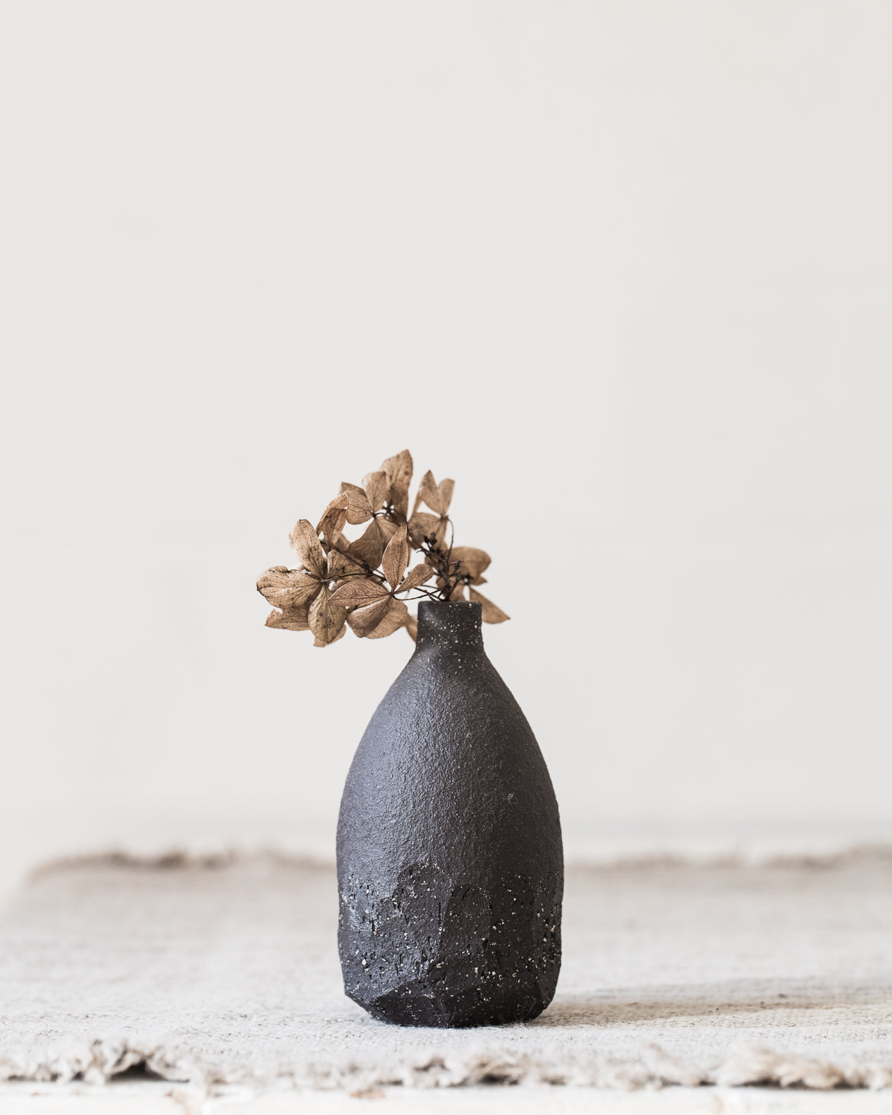 matte charcoal wabi sabi bud vase handcrafted by clay beehive ceramics