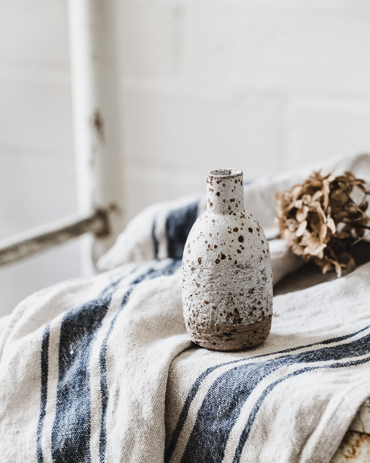 White wheel thrown speckled vases created by clay beehive ceramics 