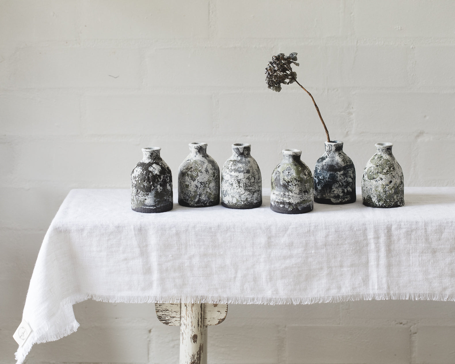 
Painted patina bottle neck bud vases handmade by clay beehive ceramics