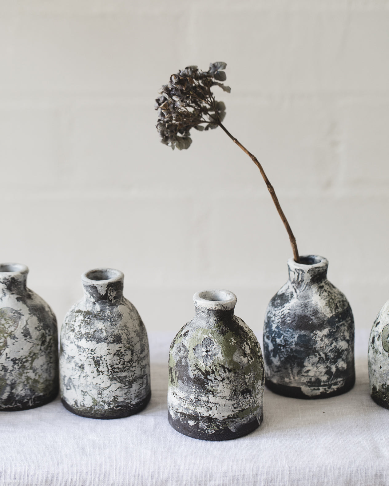 
Painted patina bottle neck bud vases handmade by clay beehive ceramics