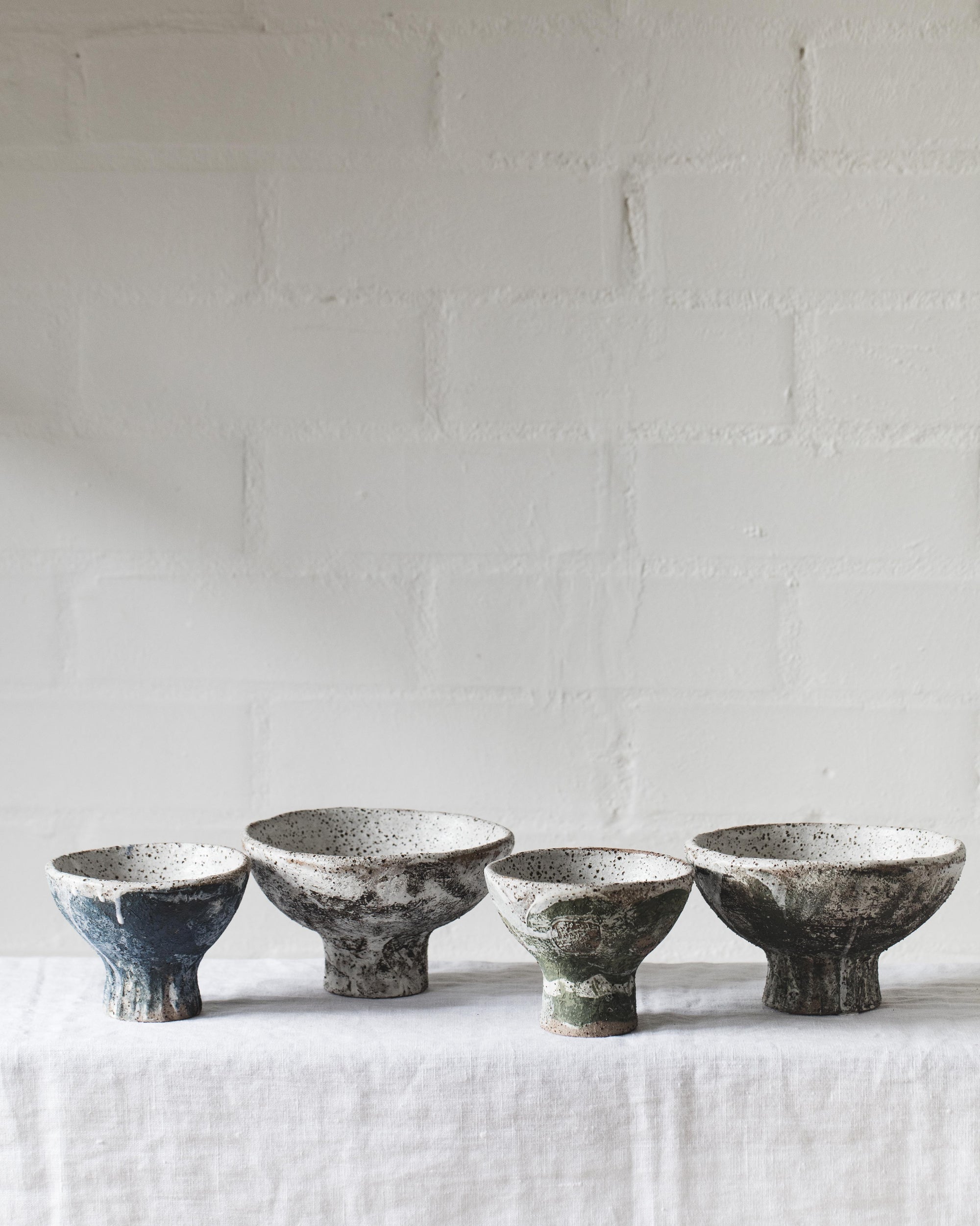 Rustic ceramic footed pedestal bowls in matte natural decor created by clay beehive ceramics 