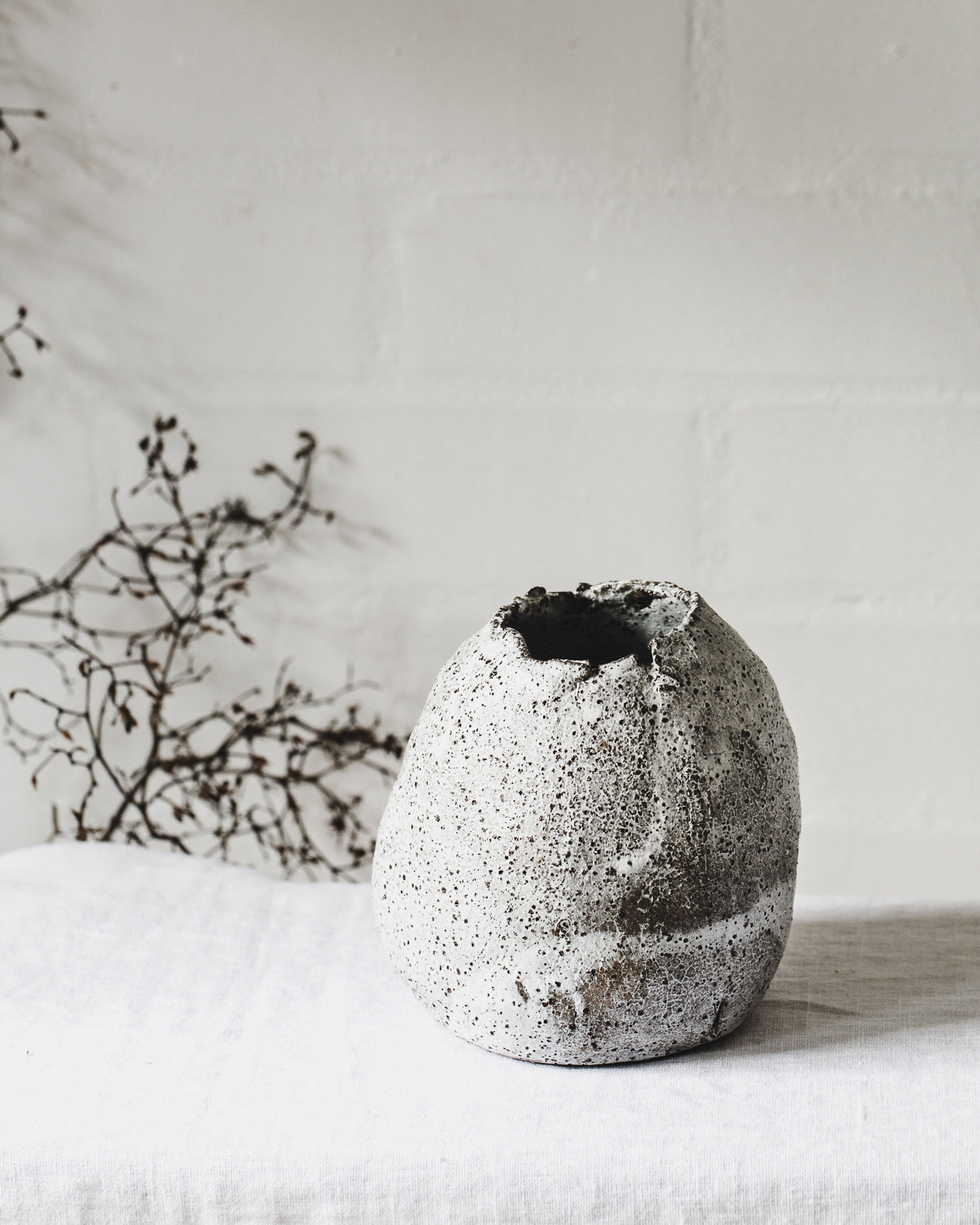 wabi sabi vase with crackled textured and speckled exterior handmade by clay beehive ceramics