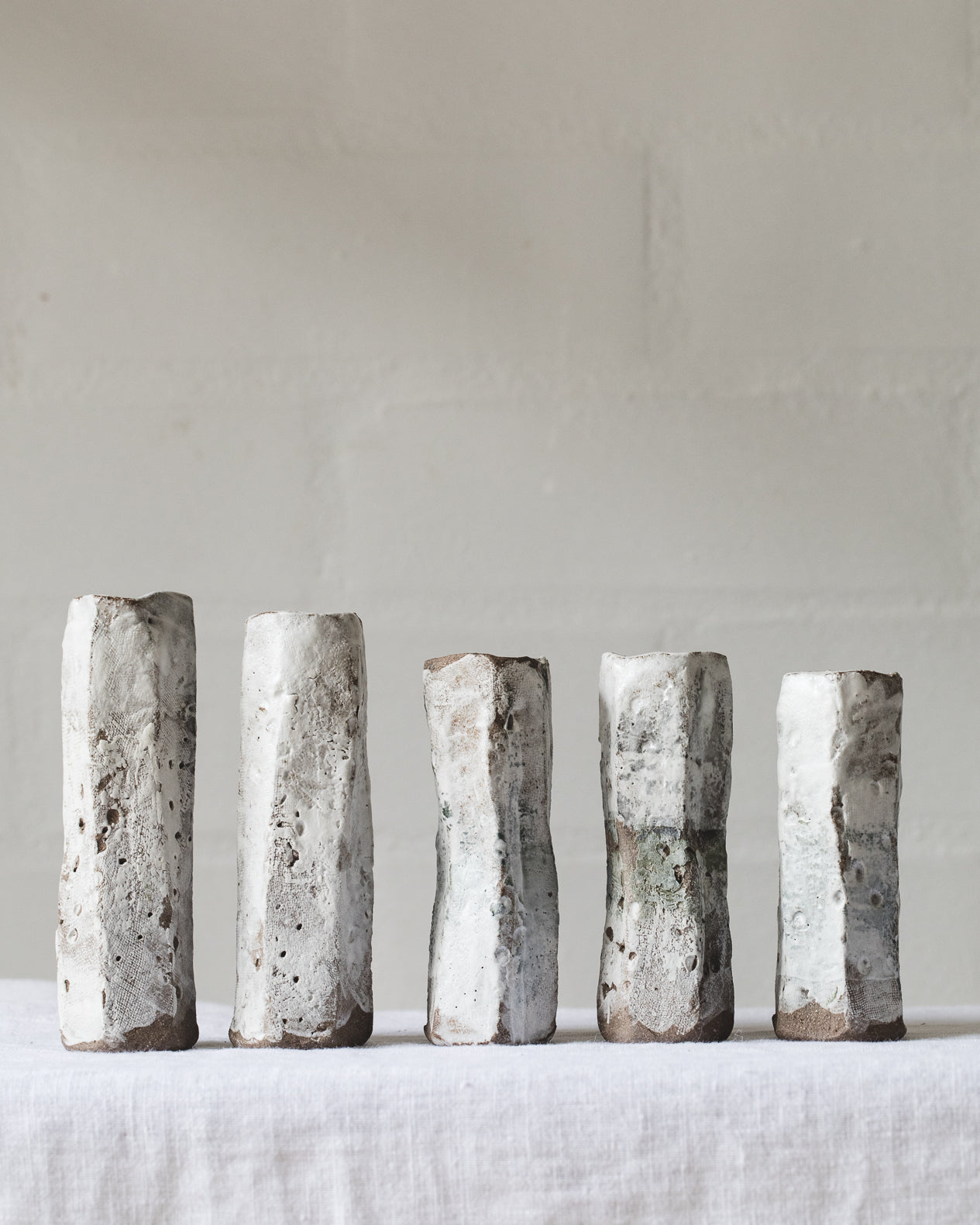 Handmade rustic white bud vases created by clay beehive ceramics 