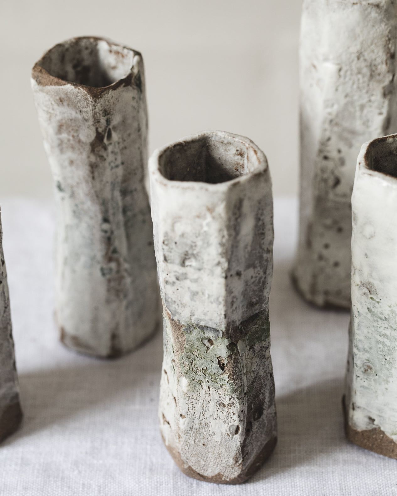 Handmade rustic white bud vases created by clay beehive ceramics 