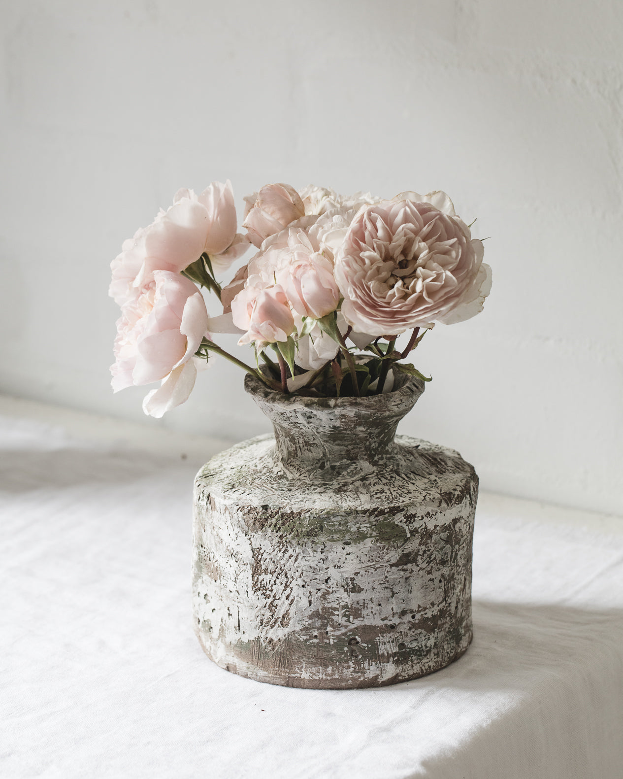 Large rustic vase with leaf carving and paint patina effect handmade by clay beehive ceramics