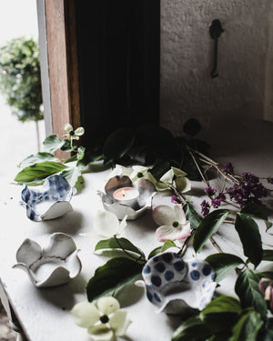 Flower shaped candle holders with spots and gingham patterns handmade by clay beehive ceramics
