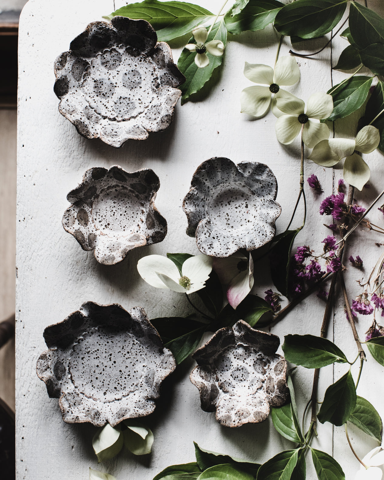 Rustic speckled spot tea light holder / small snack plate with flower shaped design by clay beehive ceramics