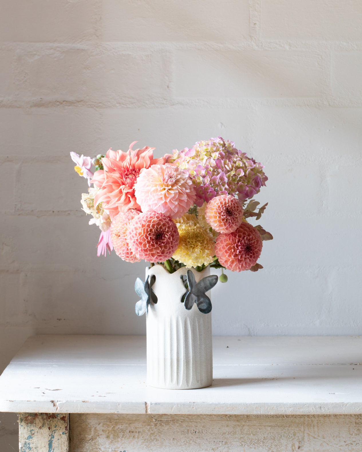 Dahlias in a beautiful butterfly ceramic vase handcreated by clay beehive ceramics