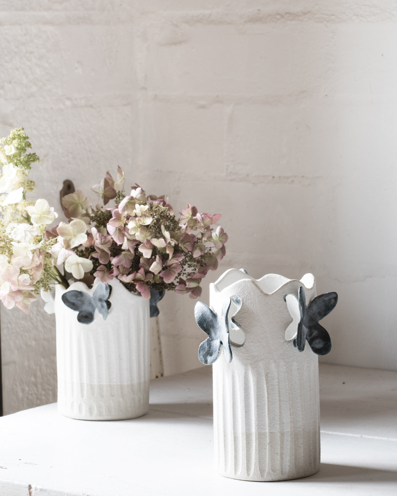 Dahlias in a beautiful butterfly ceramic vase handcreated by clay beehive ceramics