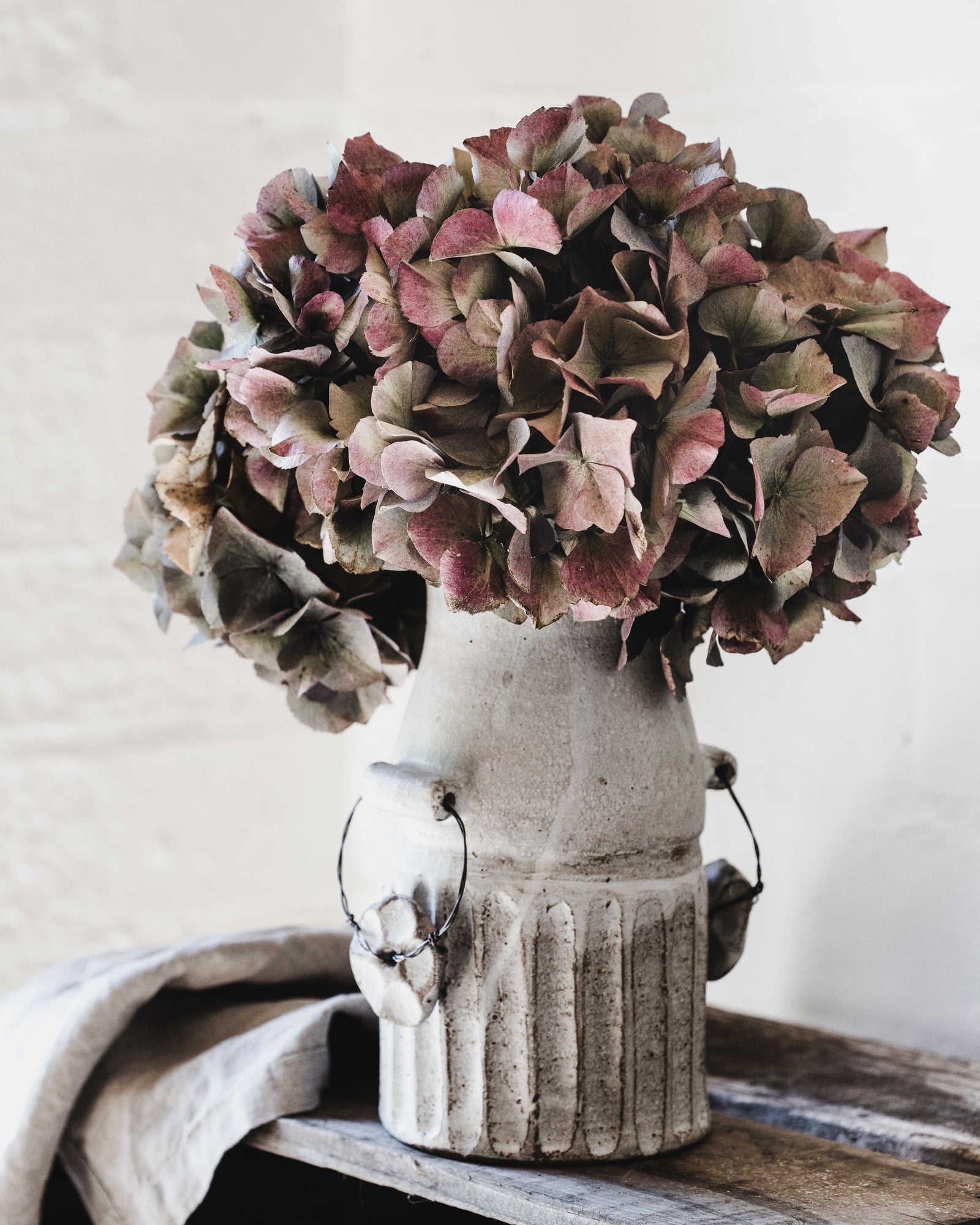 Rustic vintage farmhouse milk canister with wire side handles