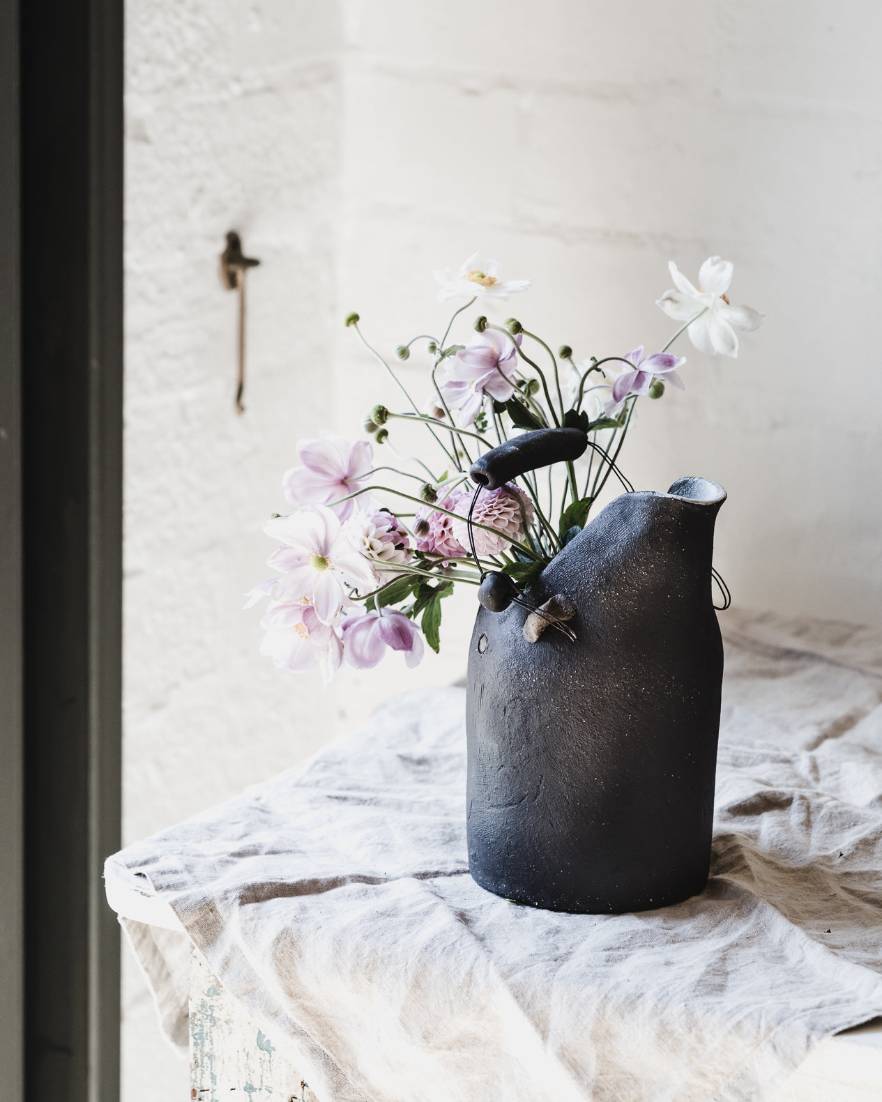 Black rustic jug with wire ceramic handle handmade by clay beehive ceramics