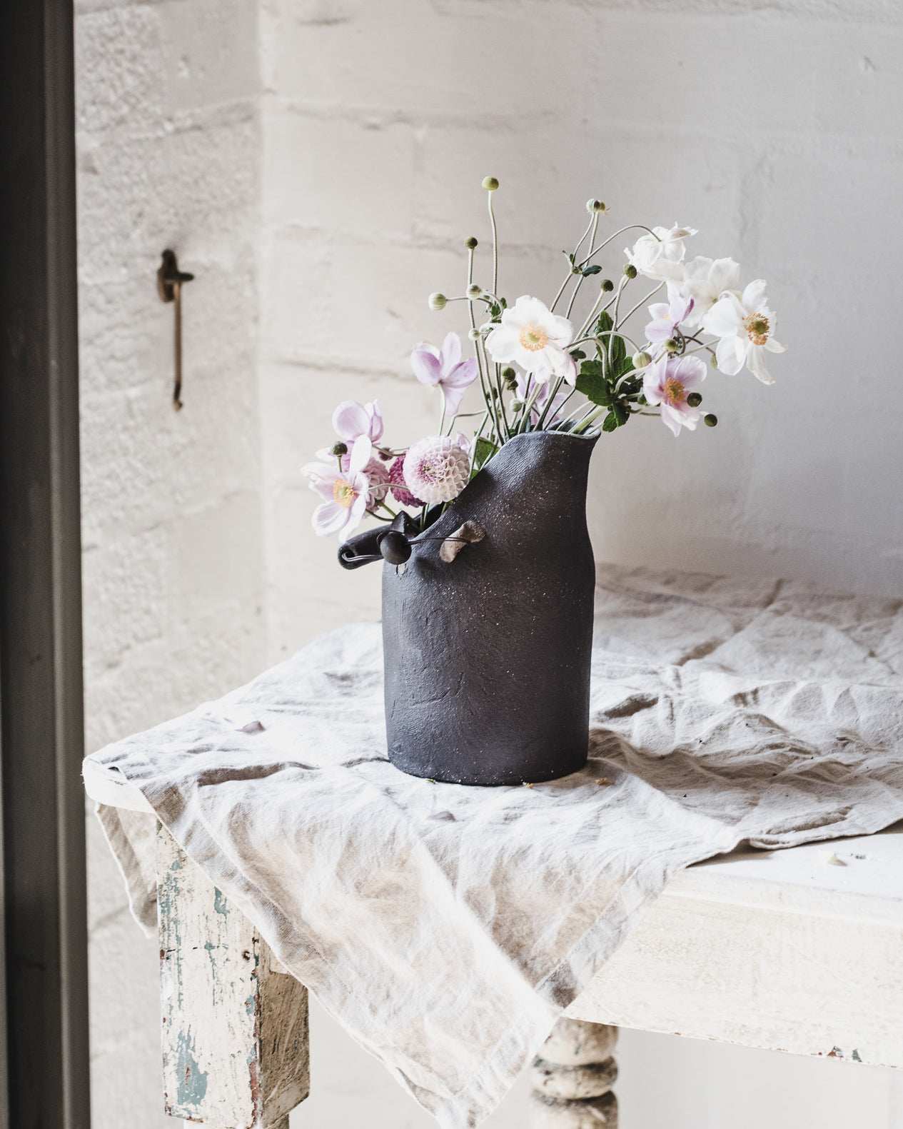 Black rustic jug with wire ceramic handle handmade by clay beehive ceramics