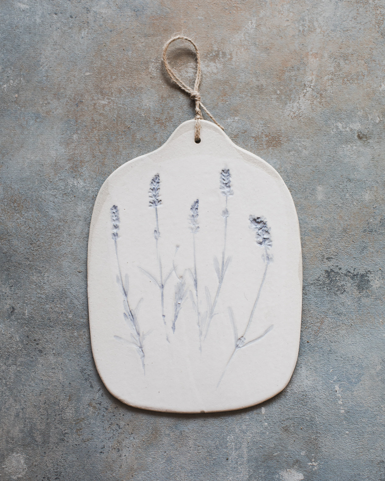 Lavender impressed cheeseboard painted blue by clay beehive ceramics