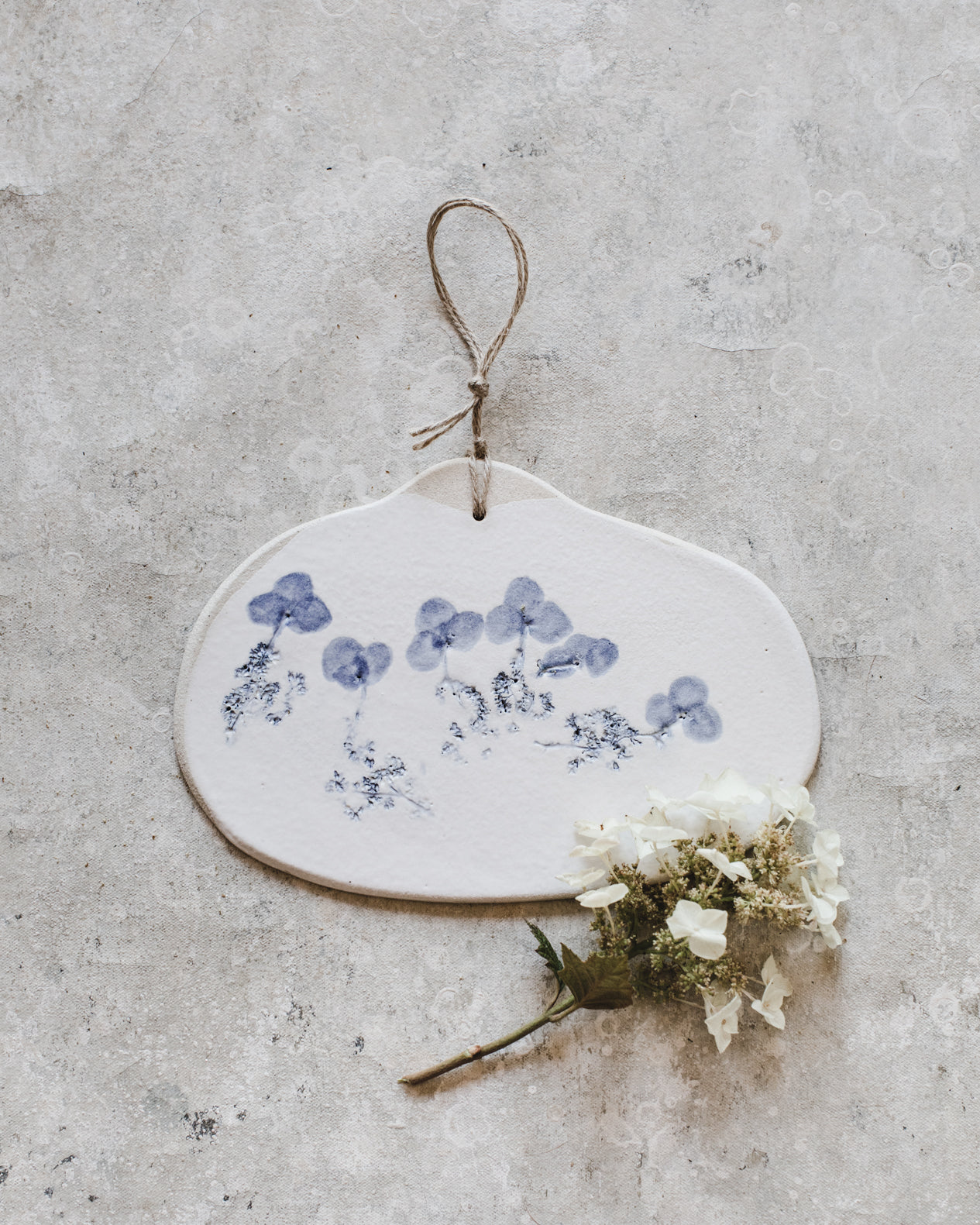 Blue and White organic shaped cheese board with botanical imprint