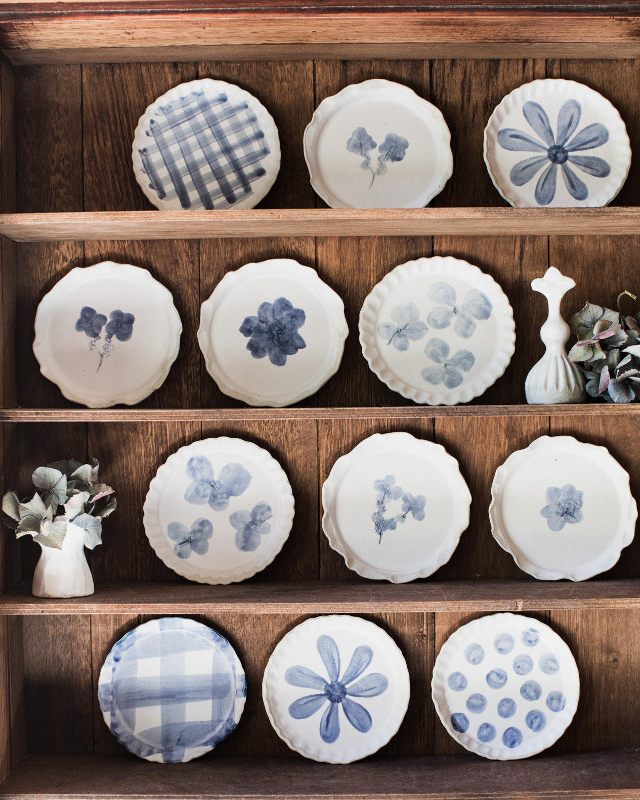 Handmade plates and little bowls in blue and white patterns by clay beehive ceramics