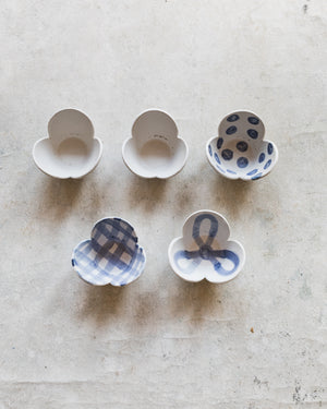 Ceramic tulip shaped bowls in blue and white patterns handmade by clay beehive ceramics