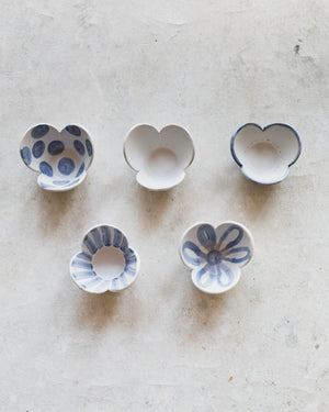 Ceramic tulip shaped bowls in blue and white patterns handmade by clay beehive ceramics