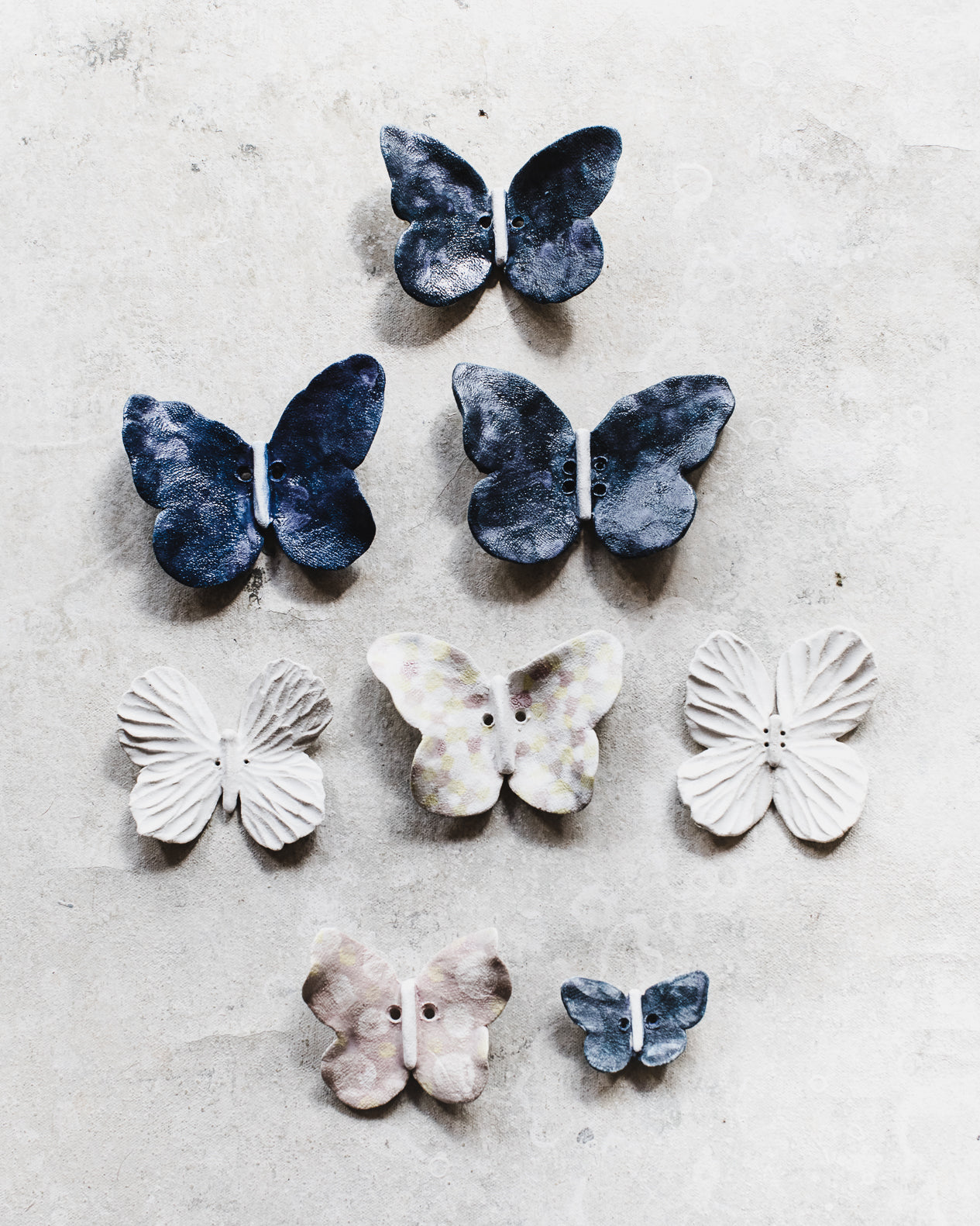 Handmade ceramic butterflies by clay beehive