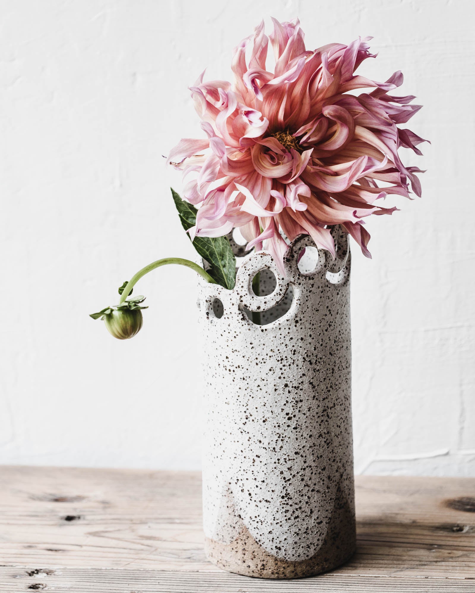 Extra Large Statement vase with cutout circle pattern and speckled clay body in matte white handmade by clay beehive ceramics