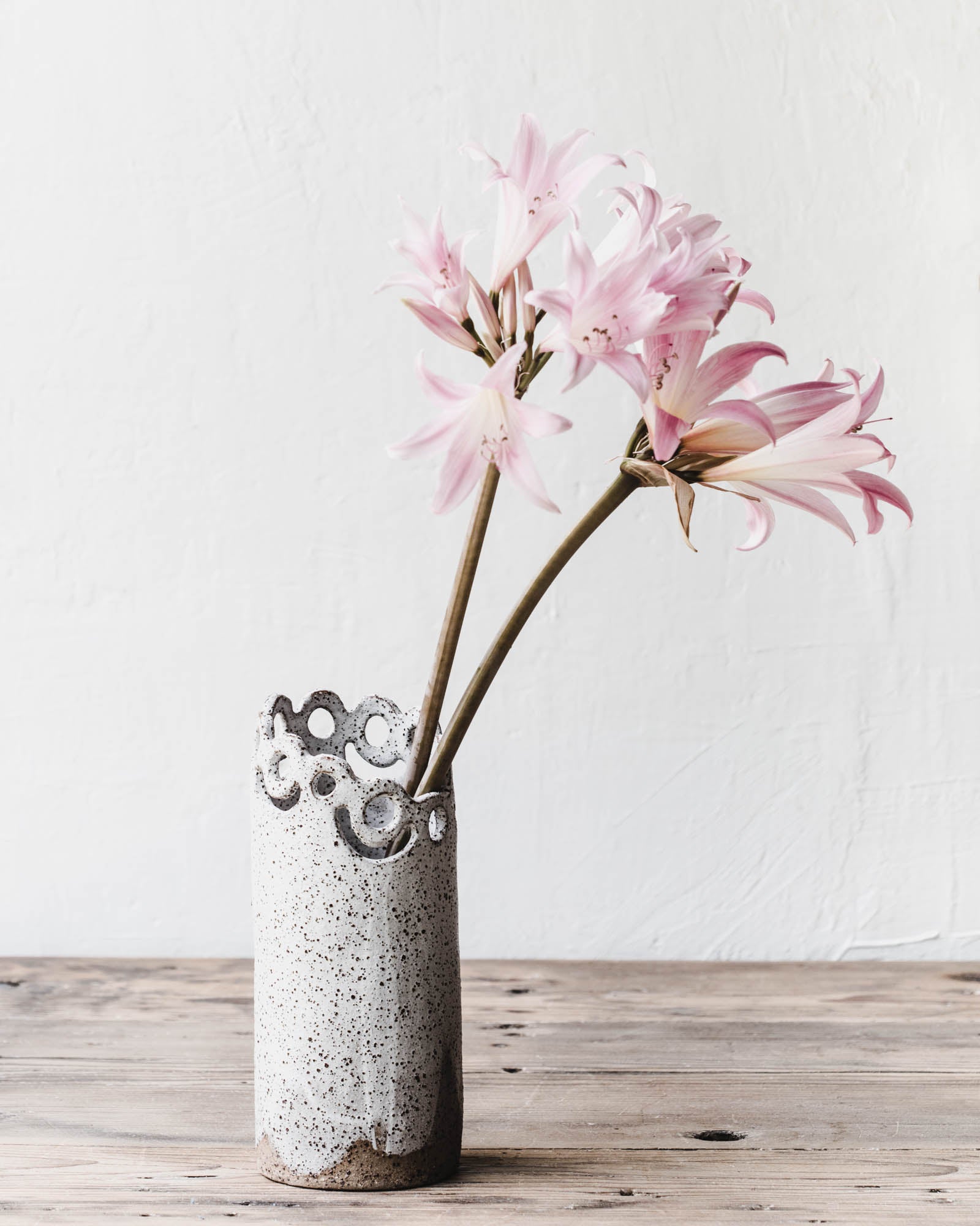 Extra Large Statement vase with cutout circle pattern and speckled clay body in matte white handmade by clay beehive ceramics
