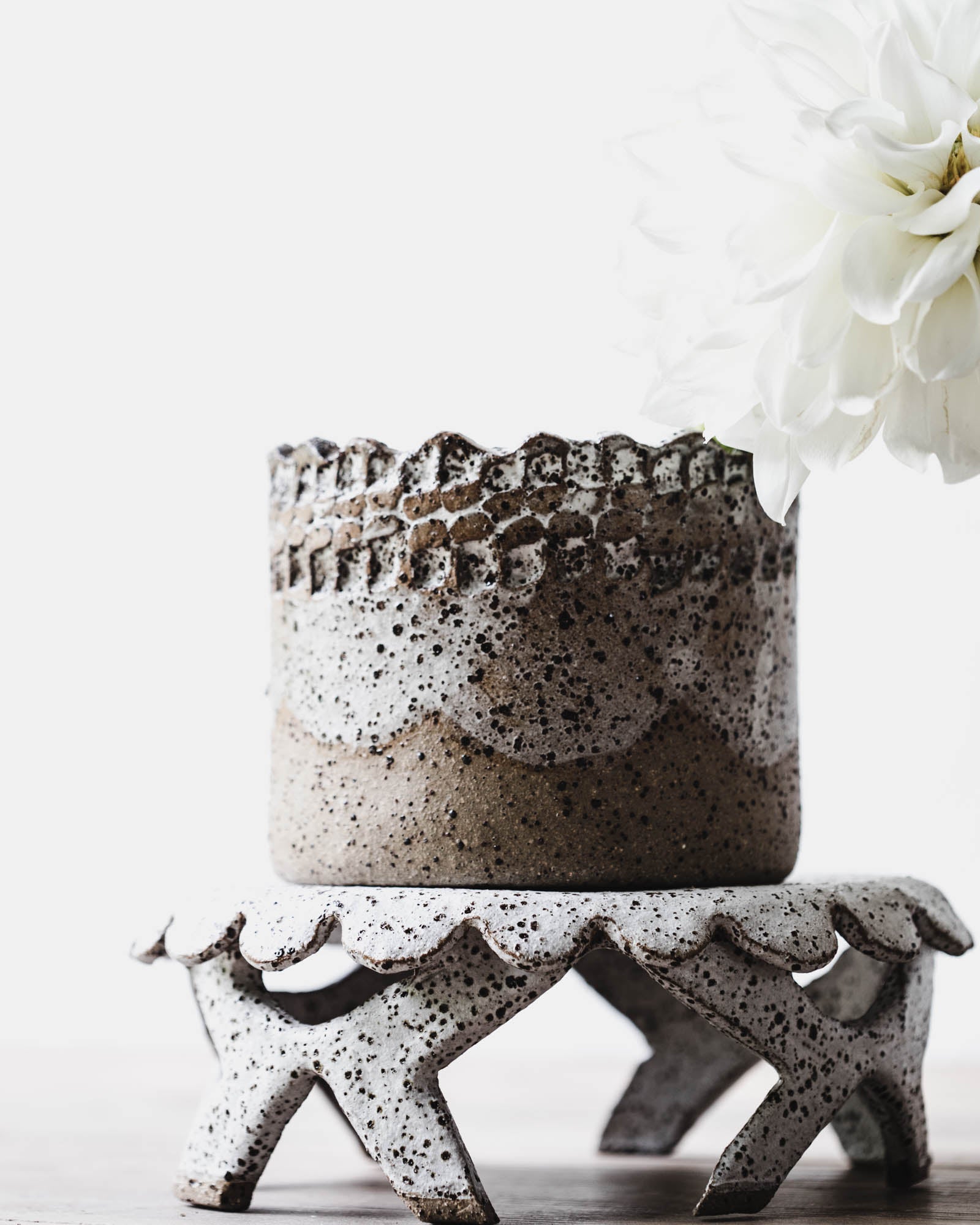 Handmade ceramic cake stand with scalloped rim and crisscrossed feet in white french country style by clay beehive ceramic