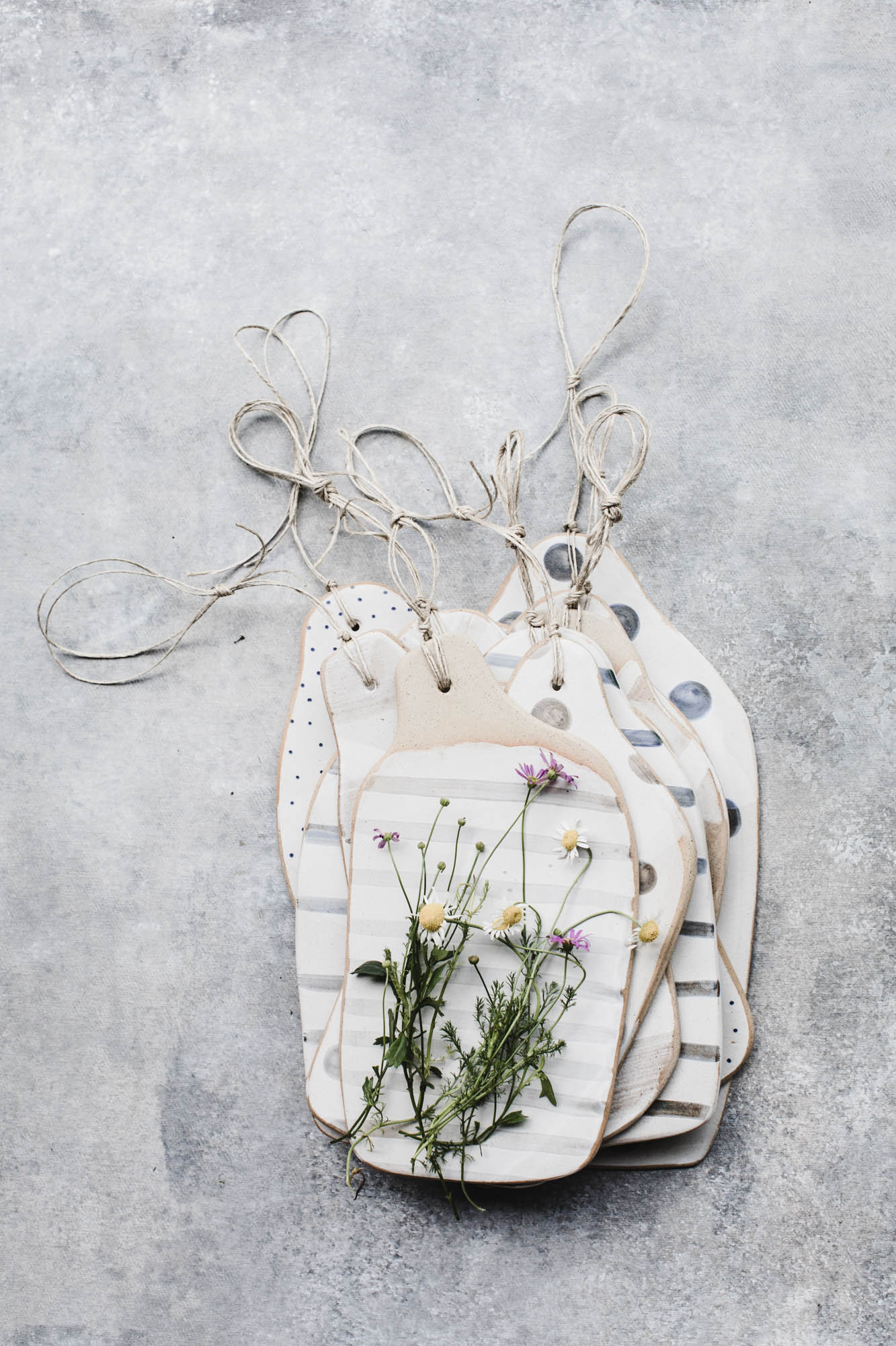 handmade patterned ceramic cheeseboard in tan speckled clay by claybeehive ceramics