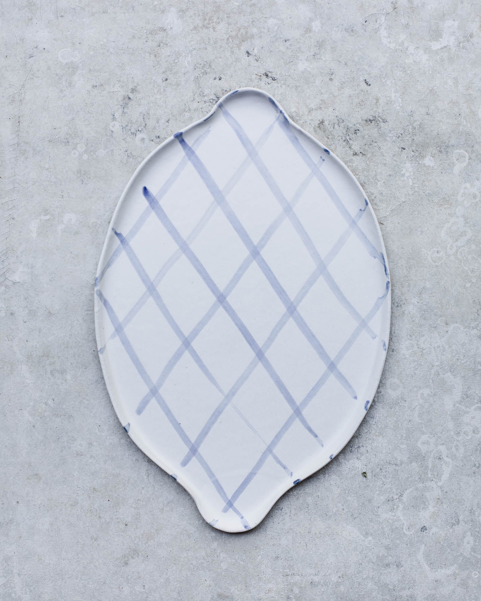 Blue and white platter with handles handmade by clay beehive ceramics