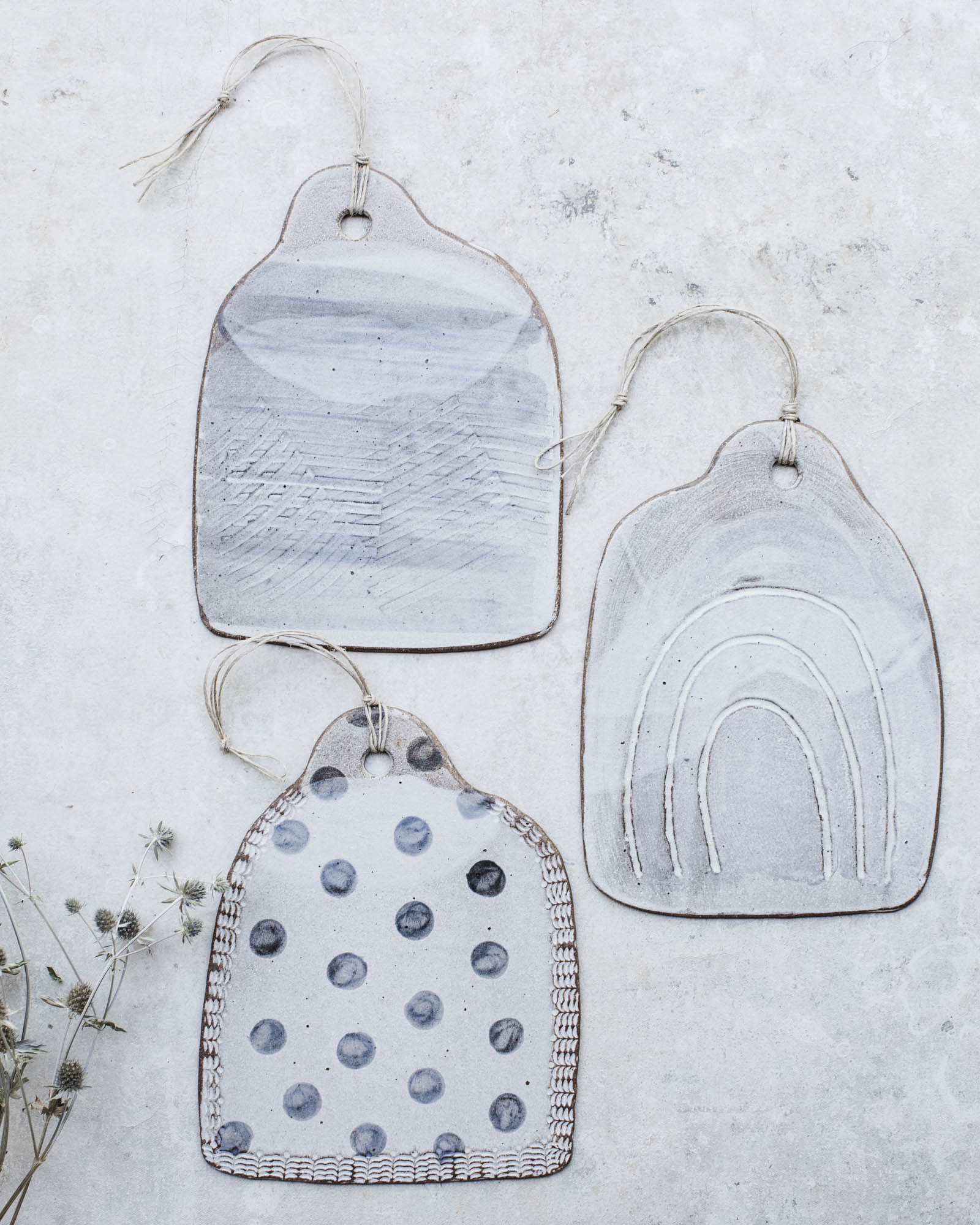 Dark stoneware cheeseboards with grey patterns and textures by clay beehive ceramics