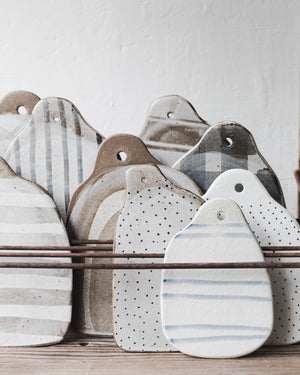 Handmade ceramic cheeseboards with patterns in a rustic style by clay beehive ceramics