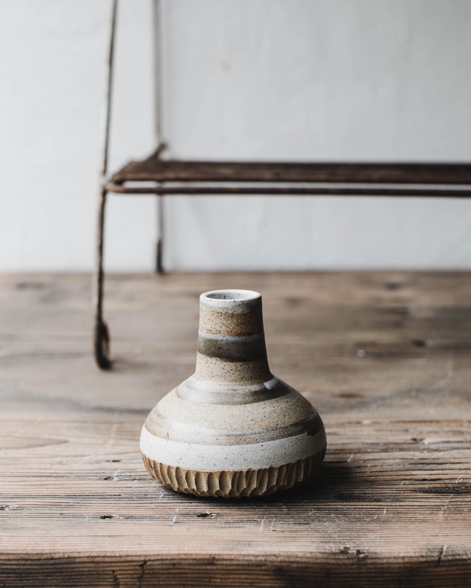 Wheel thrown bud vases with a speckled tan / patterned decoration by clay beehive ceramics