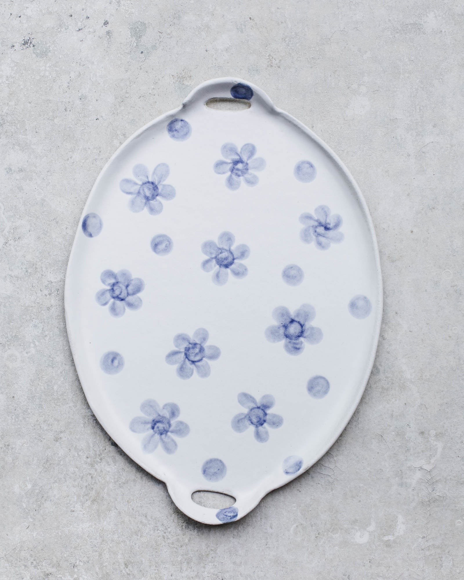 Large handled handmade ceramic platter/cheeseboard by clay beehive ceramics with botanical design in blue and satin white finish