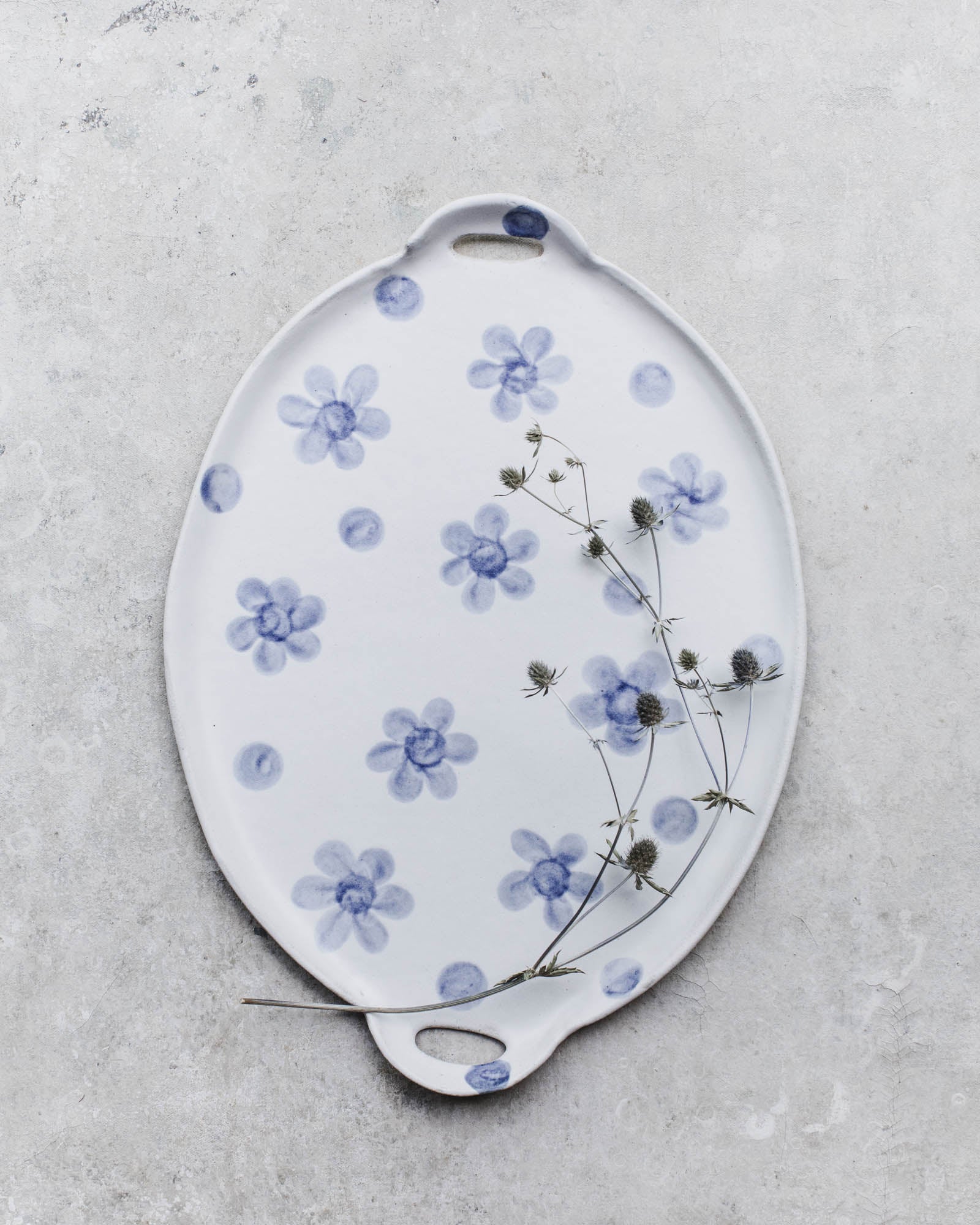 Large handled handmade ceramic platter/cheeseboard by clay beehive ceramics with botanical design in blue and satin white finish