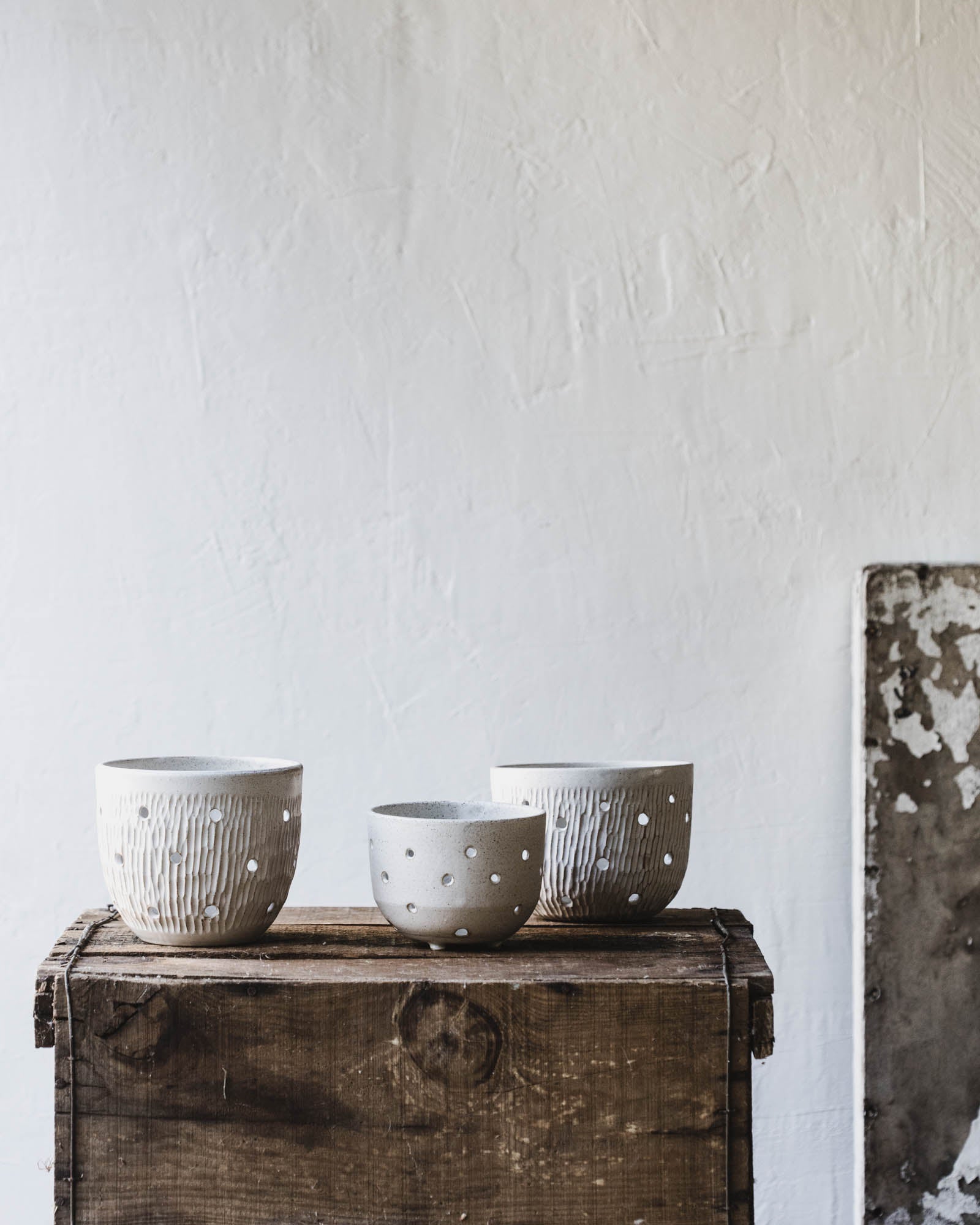 Wheel-thrown orchid pots with holes for aeration by clay beehive ceramics