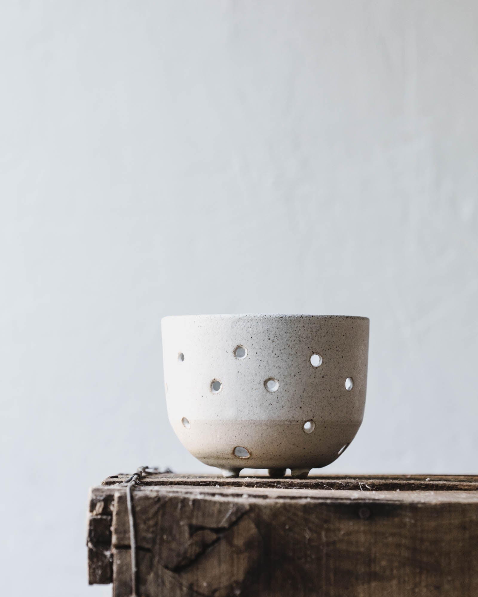 Wheel-thrown orchid pots with holes for aeration by clay beehive ceramics