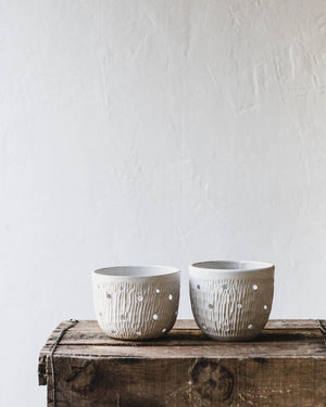 Wheel-thrown orchid pots with holes for aeration by clay beehive ceramics