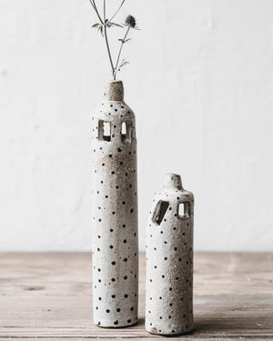 Rustic slender tiny spot bud vases with decorative cutout details handmade by clay beehive ceramics.