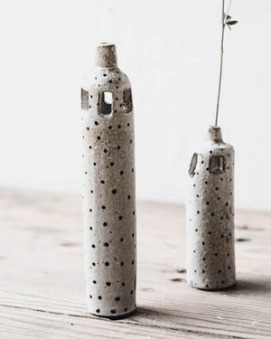 Rustic slender tiny spot bud vases with decorative cutout details handmade by clay beehive ceramics.