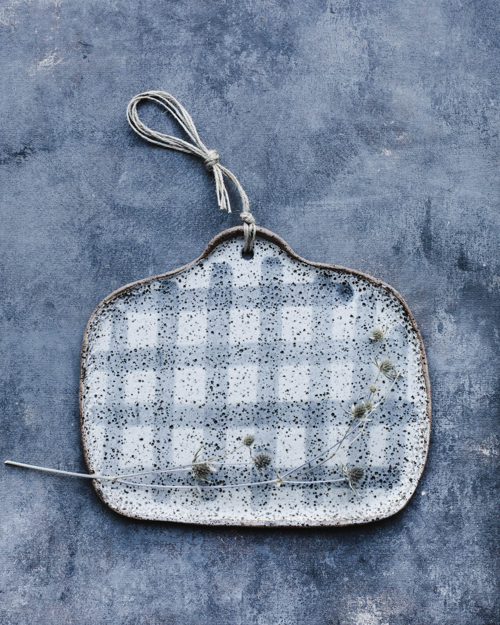 Square shaped cheese platter in gritty speckled tartan pattern finish by Clay Beehive 